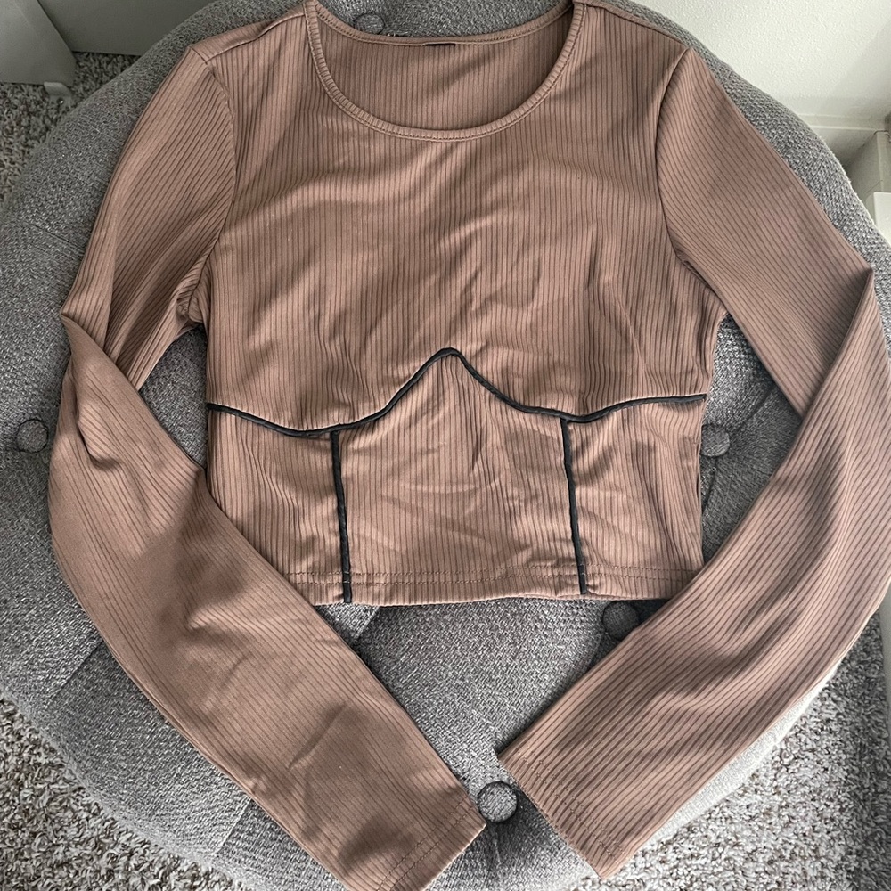 Long sleeve shirt. Size is small and is brown with black stitching.
